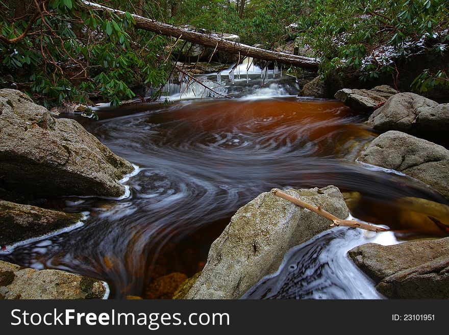 Natural tannin colored stream in the mountains