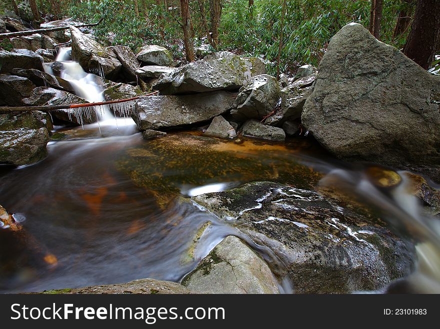 Waterfalls in the mountains in winter with silky flow. Waterfalls in the mountains in winter with silky flow