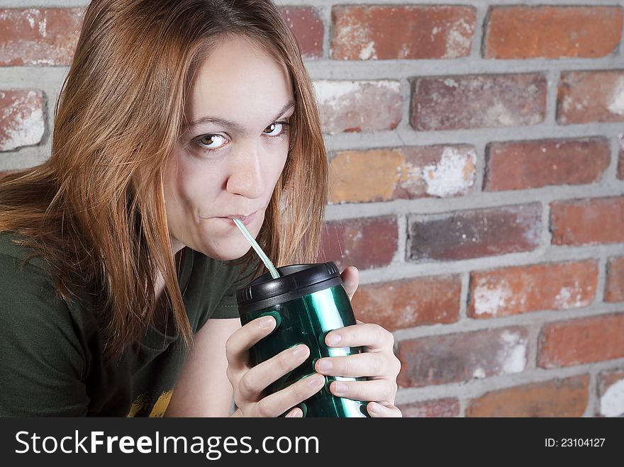 Girl drinking something in a cup