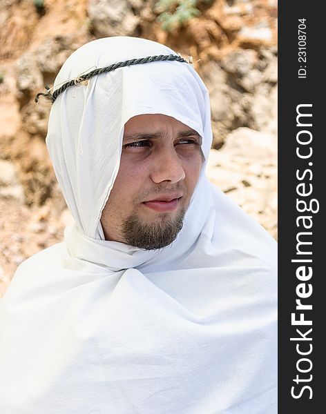 Intently looking, bearded man in Arab dress