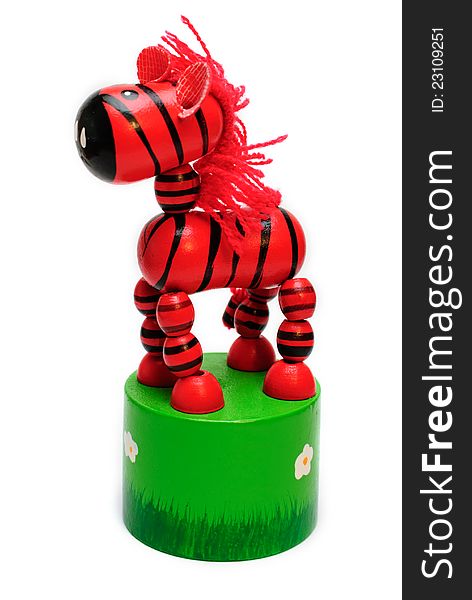 Isolated wooden toy. springy red horse with a fishing line inside. Isolated wooden toy. springy red horse with a fishing line inside