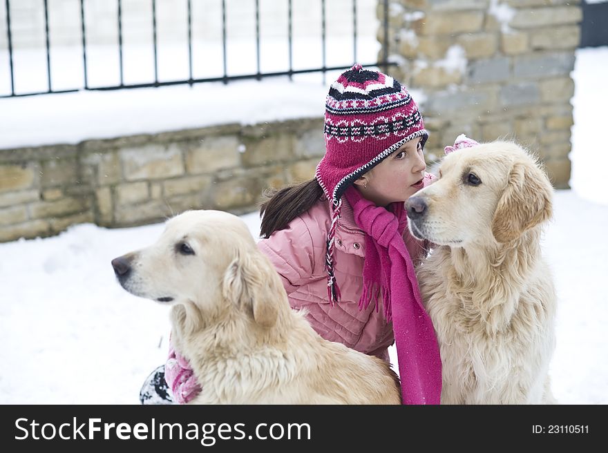 Little girl playing with her dogs. Little girl playing with her dogs