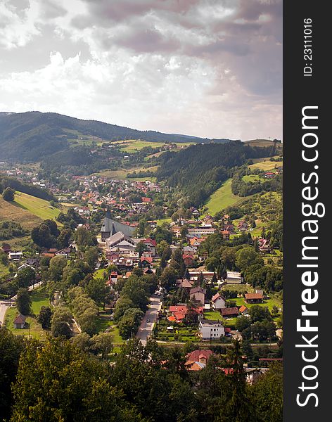 Vertical photo of a town in a mountain valley - Rytro, Poland. Vertical photo of a town in a mountain valley - Rytro, Poland