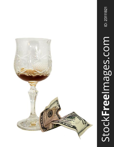 Empty glass of grog and tip dollars on white background
