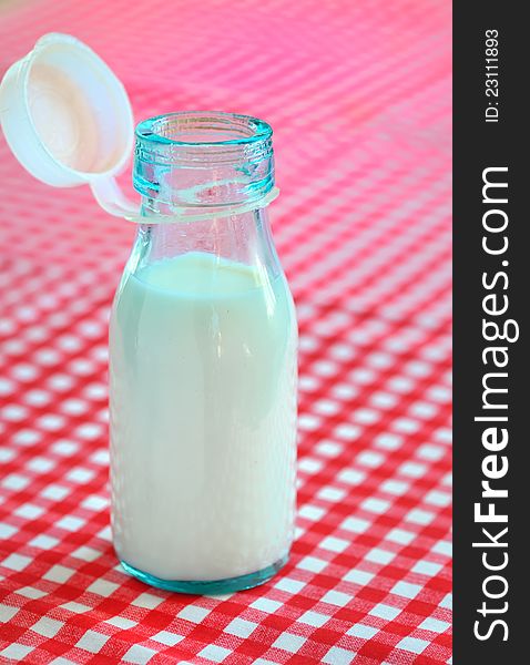 Bottle of milk on table shoot in studio
