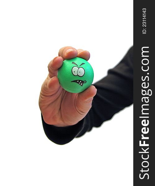 Closeup of a man's hand holding a green unhappy ball over white. Closeup of a man's hand holding a green unhappy ball over white