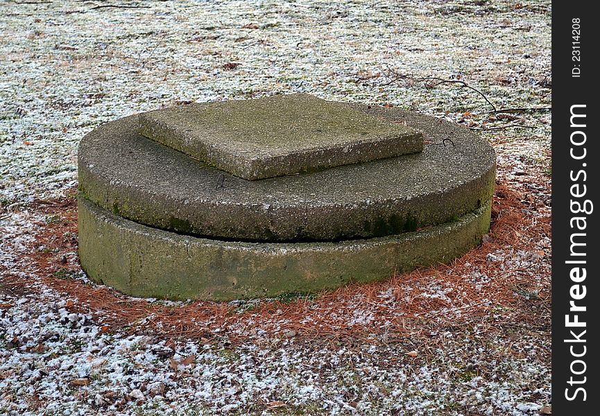 An old well cover on a cold winter morning.