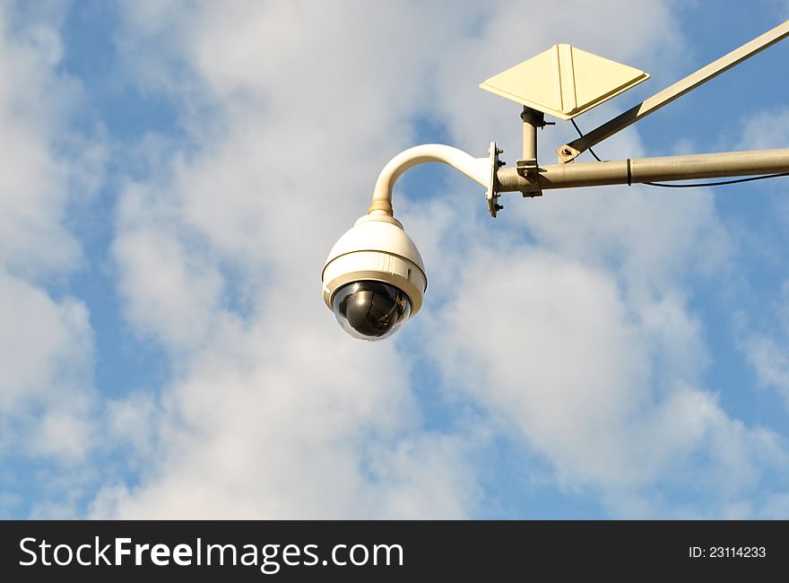 Image of a traffic camera on a beautiful blue sky