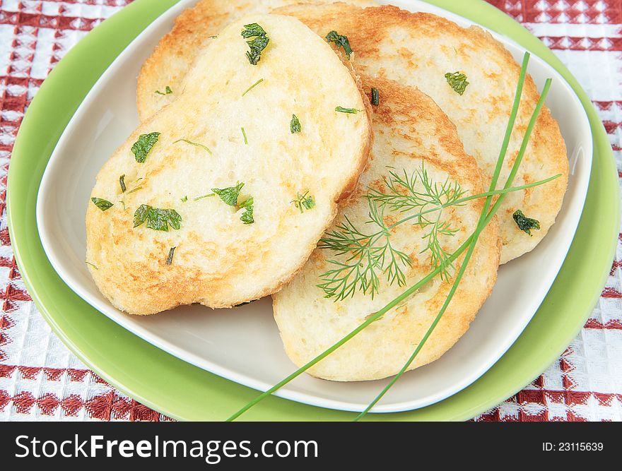 French toast, fried with egg and greens on a green plate