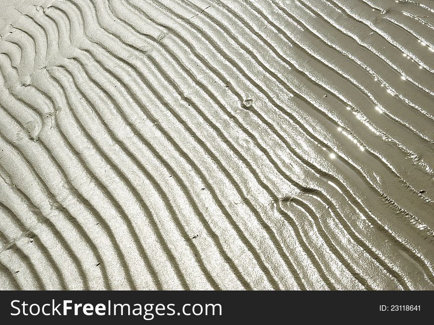 Pattern created by sand and water. Pattern created by sand and water.
