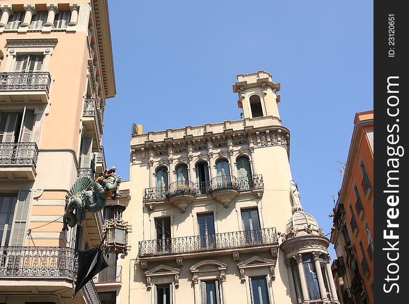 Dragon and umbrella in Ramblas street, Barcelona, Spain