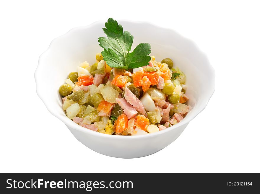 Russian traditional salad olivier. Salad with vegetable and ham in bowl