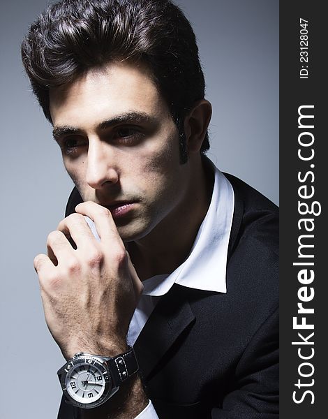 Attractive young businessman posing whit his watch. Attractive young businessman posing whit his watch