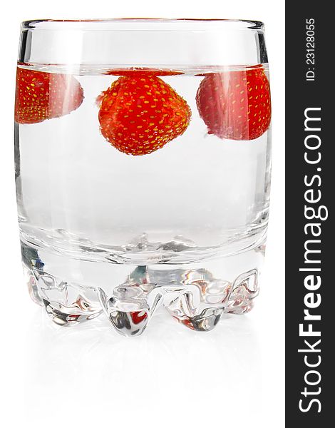 Water in glass with strawberry on white background