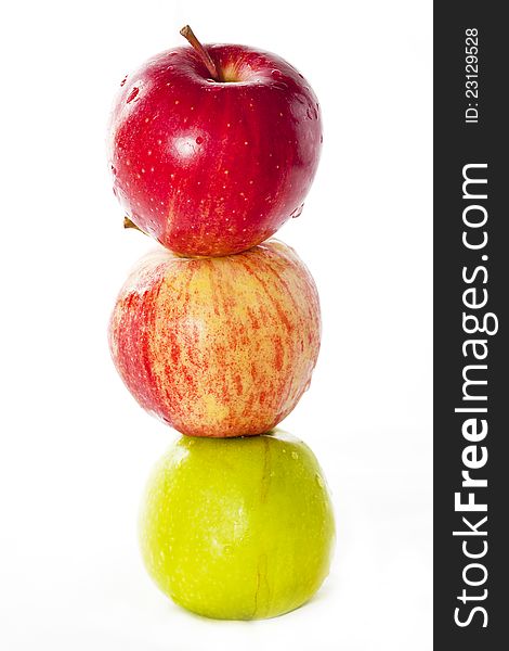 Tree apples in vertical row.  on white.