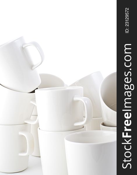 Many stacked of white cups on white background