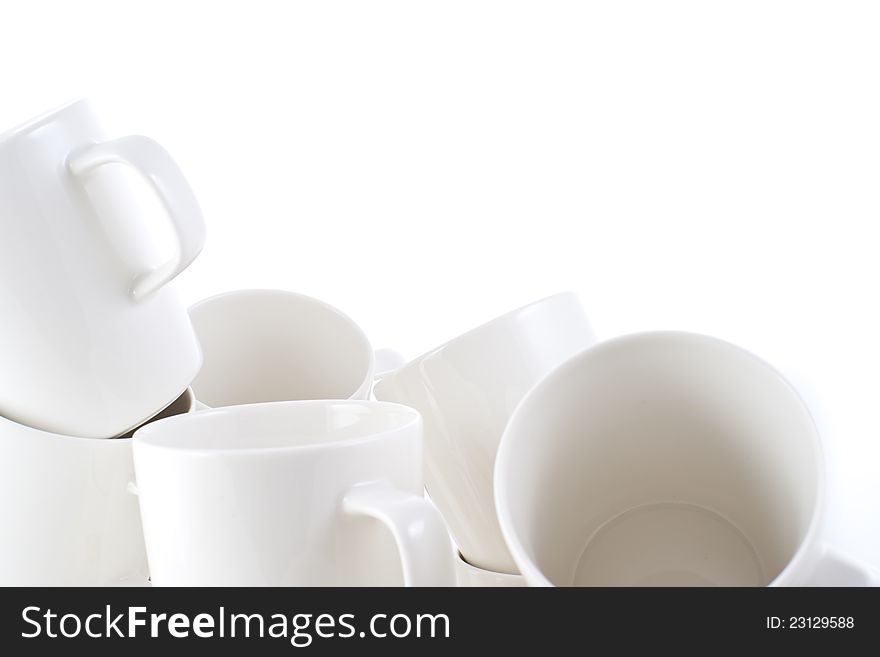 Many stacked of white cups on white background