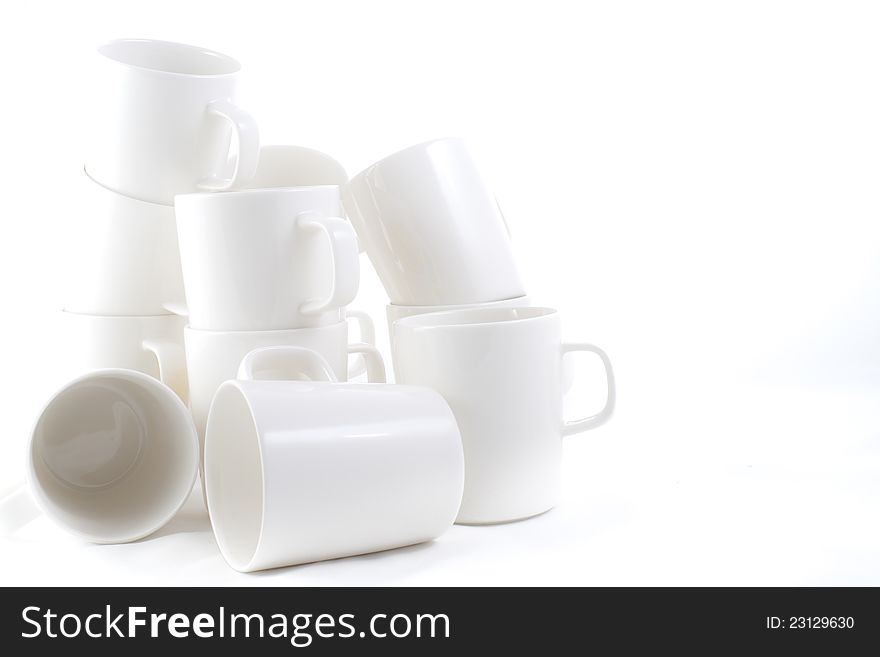 Many stacked of white cups on white background