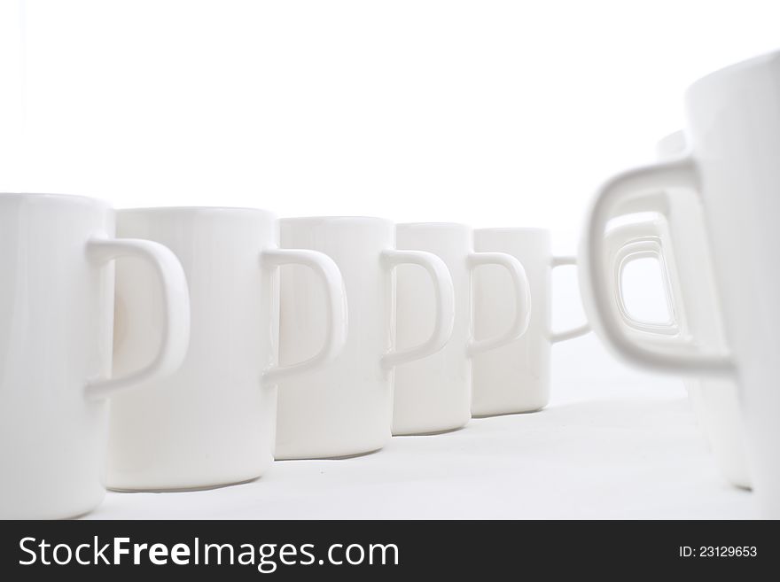 Line of white cups,
on white background