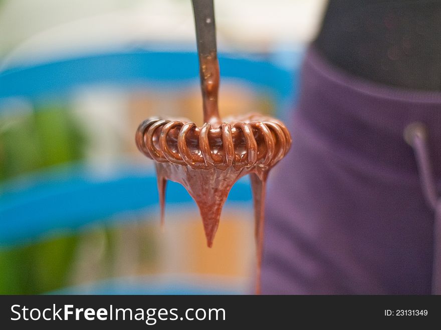 Mixer dipped in melted chocolate. Mixer dipped in melted chocolate.