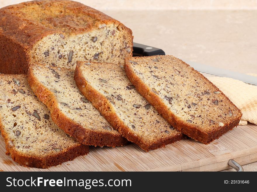 Slices of nut bread on a cutting board. Slices of nut bread on a cutting board