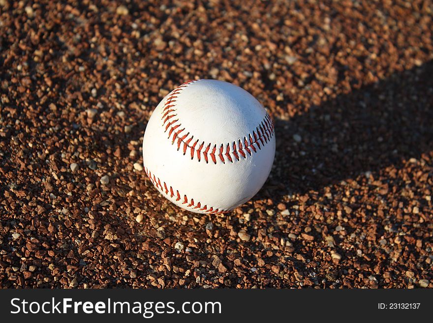 Close up of a baseball on a baseball diamond. Close up of a baseball on a baseball diamond.