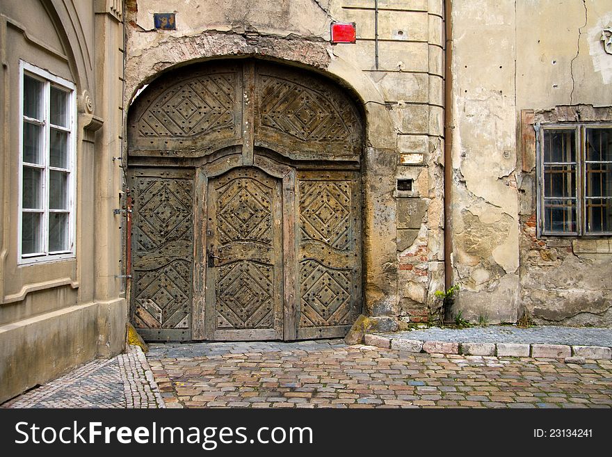 An old wooden ancient gate. An old wooden ancient gate