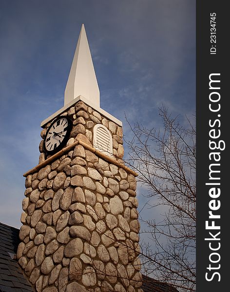 chapel steeple with clock, pointing to the sky. chapel steeple with clock, pointing to the sky.