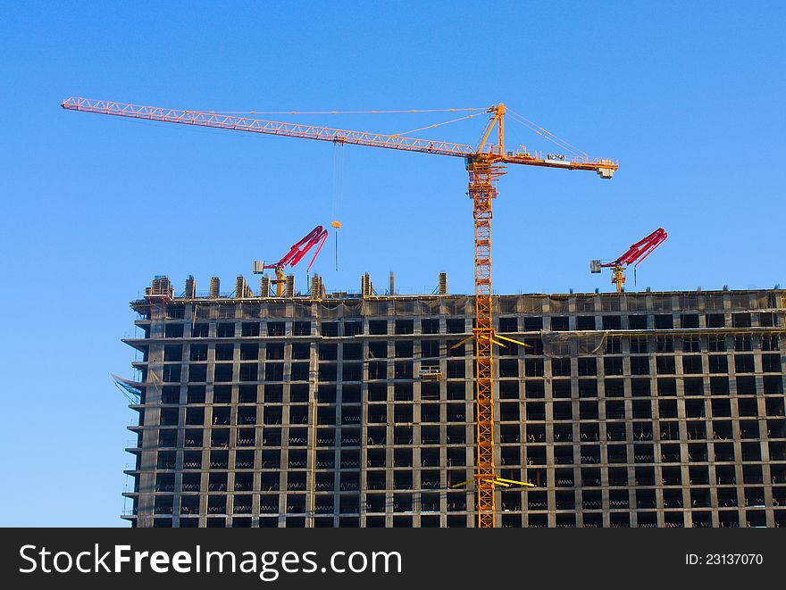 Construction site with crane and building