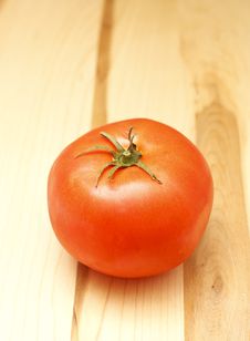 Red Ripe Tomato On Wood Computer Stock Photo