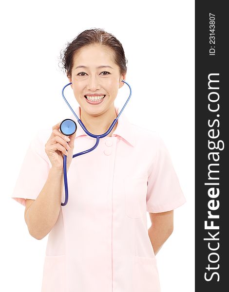 Asian female nurse with a stethoscope listening. Asian female nurse with a stethoscope listening