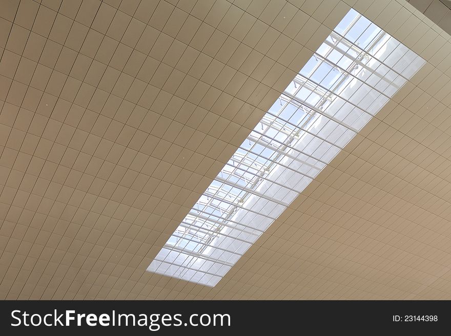 Modern architectural roof  fragment of ceiling with glass window. Modern architectural roof  fragment of ceiling with glass window