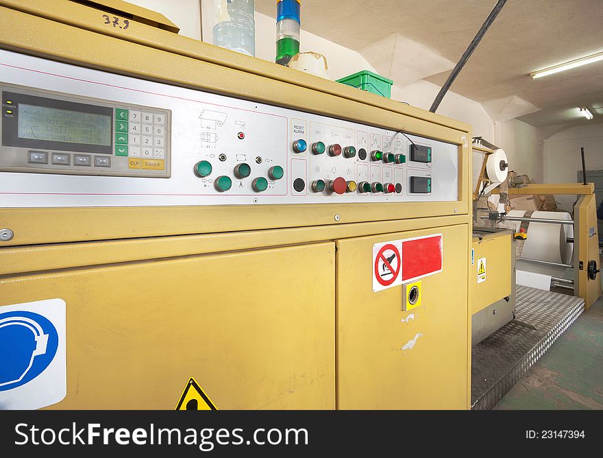 Interior of a factory, old machine for printing. Interior of a factory, old machine for printing.