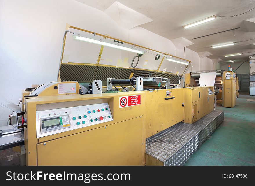 Interior of a factory, old machine for printing. Interior of a factory, old machine for printing.