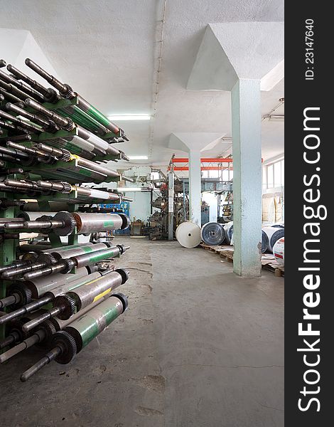 Interior of a factory, old machine for printing. Interior of a factory, old machine for printing.