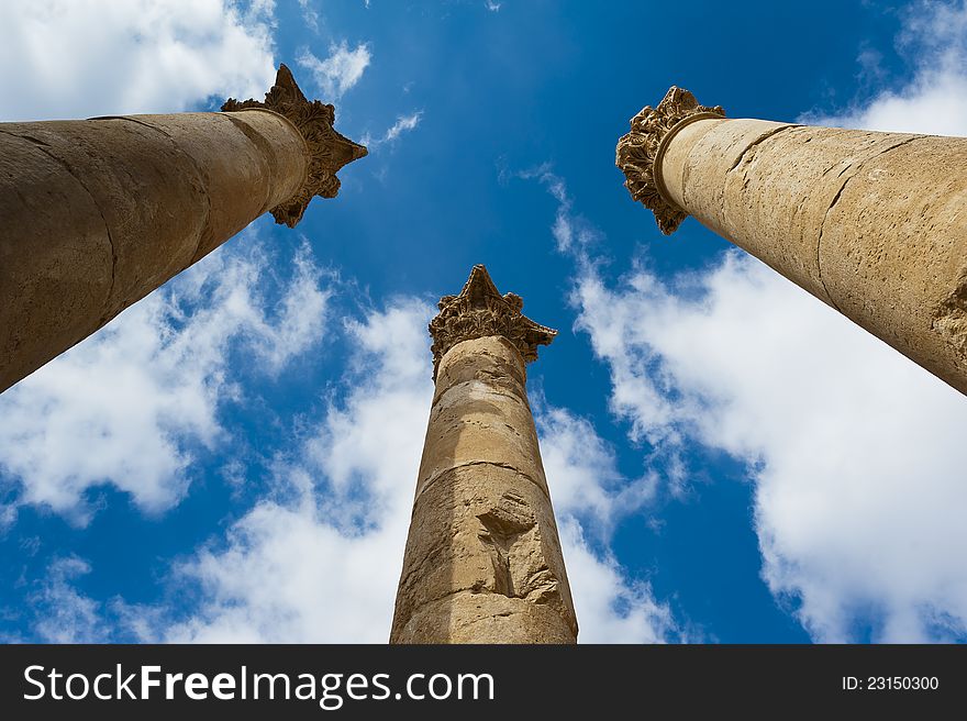 Columns toped with capitals reaching for the sky in the temple of Artemis at Jerash, Jordan. These mammoth pillars, built almost two millennia ago were designed to sway gently, absorbing the effects of earth tremors and high winds. Columns toped with capitals reaching for the sky in the temple of Artemis at Jerash, Jordan. These mammoth pillars, built almost two millennia ago were designed to sway gently, absorbing the effects of earth tremors and high winds.