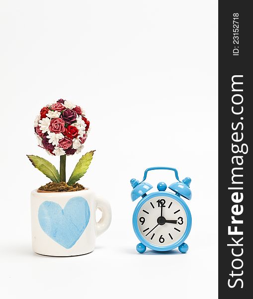 Blue Cup Wiht Heart Symbol And Blue Alarm Clock