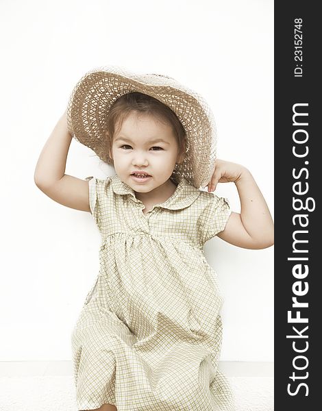 Three year old girl in asian hat. Three year old girl in asian hat