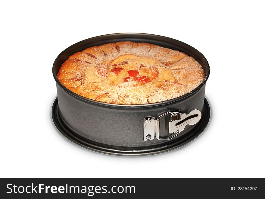 Homemade apple pie in a baking dish on white isolated background. Homemade apple pie in a baking dish on white isolated background