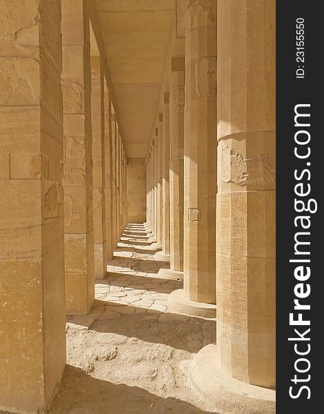 A colonnade of ancient columns at  the Temple of Queen Hatshepsut at Luxor (Egypt ). A colonnade of ancient columns at  the Temple of Queen Hatshepsut at Luxor (Egypt )