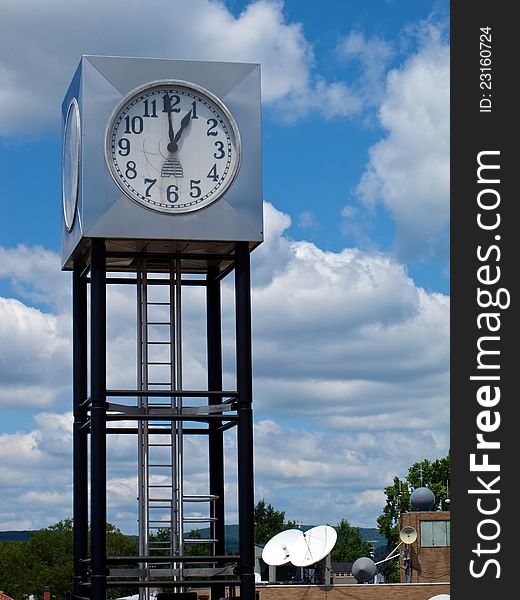 Modern Cube-Shaped Clock Tower in Mountain Setting