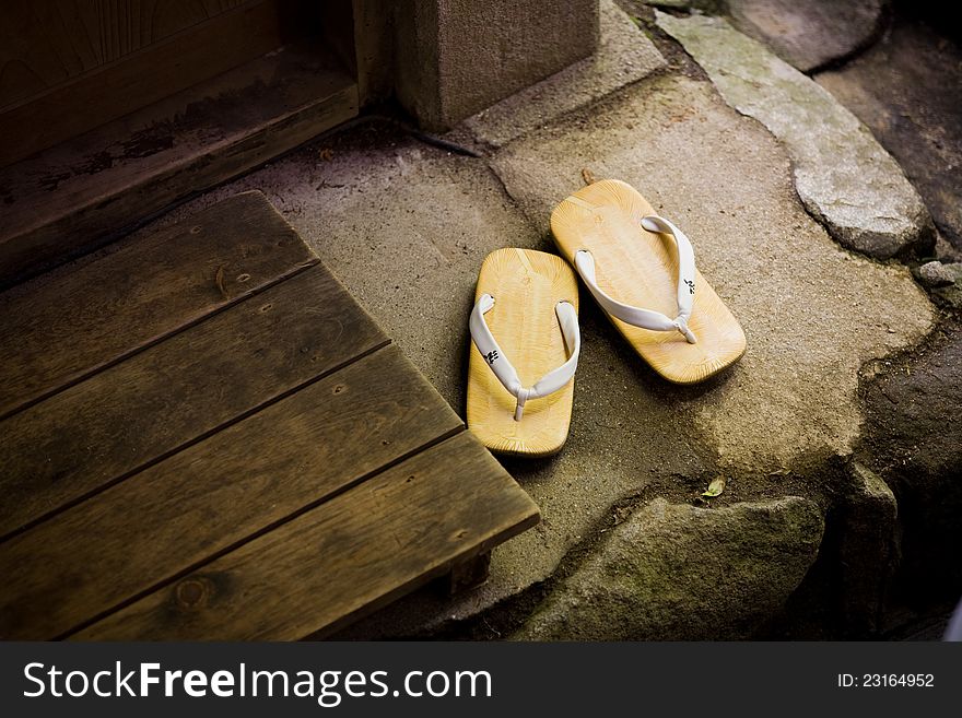 It is the sandals which I took off to be in the house. It is the sandals which I took off to be in the house