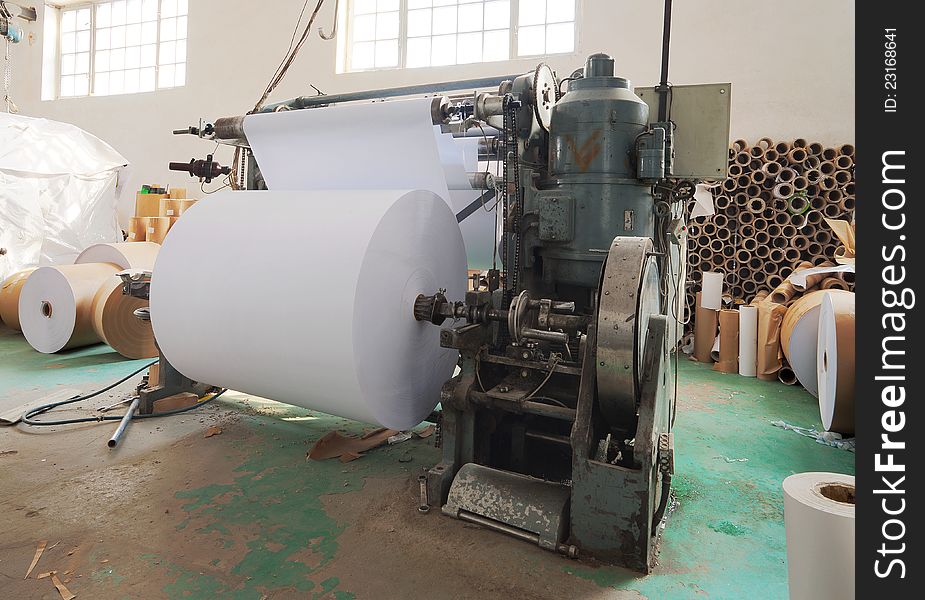 Interior of a factory, old machine for printing. Interior of a factory, old machine for printing.