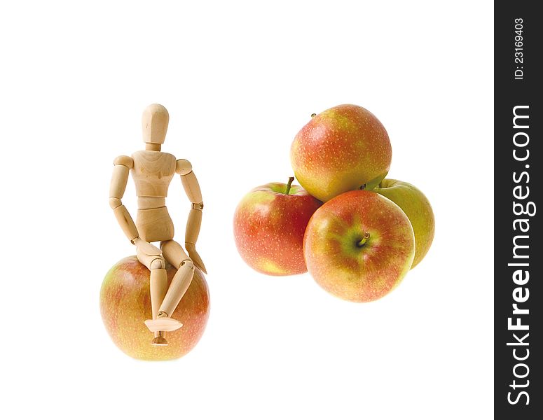 Wooden Model Sits On An Apple