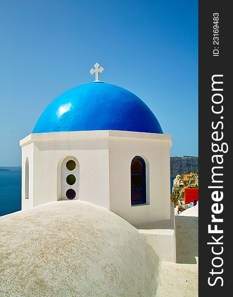 A blue cupola seen on the island Santorini Greece