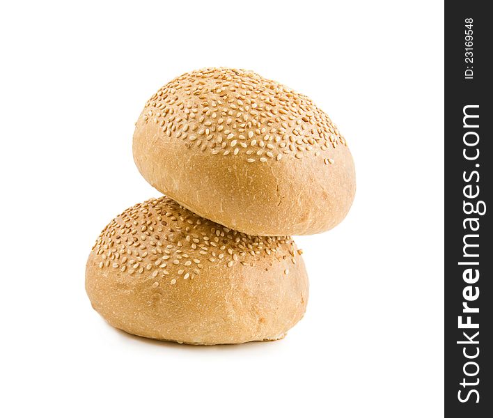 Rolls with sesame by a hill on a white background. Rolls with sesame by a hill on a white background