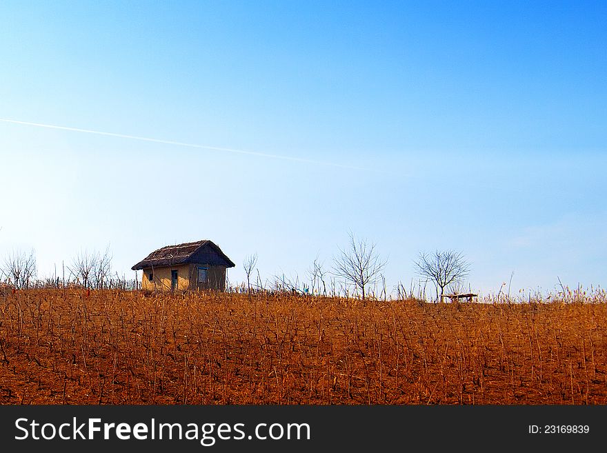 Little house on top of the hill landscape