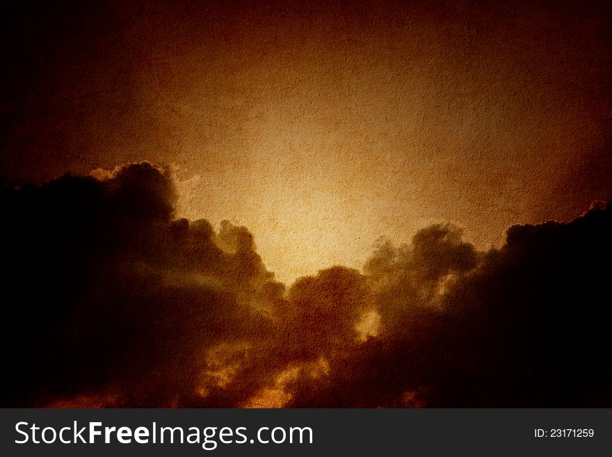 Dramatic background - dark sky, bright sun on textured paper