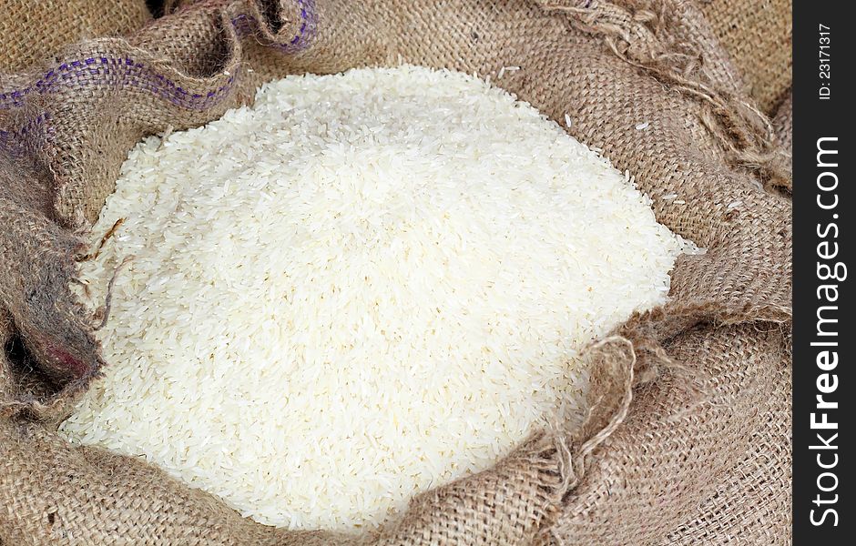 White long rice in burlap sack