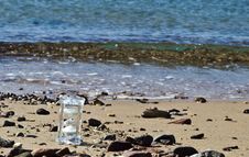 Crystal Hourglass On Marine Beach Royalty Free Stock Image